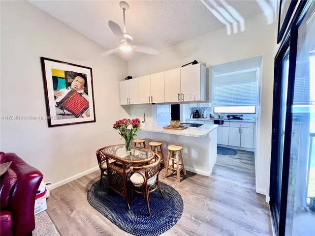 a view of a storage and utility room with washer and dryer