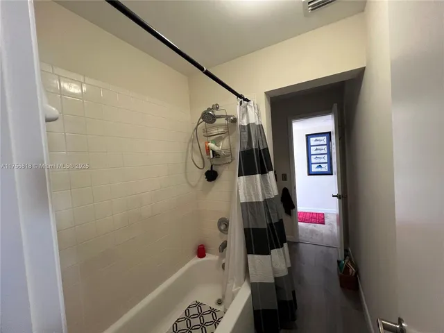 a view of entryway with wooden floor and stairs