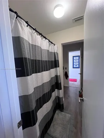 a view of walk in closet with rug