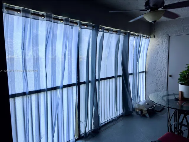 a view of a car parked on the side of the road