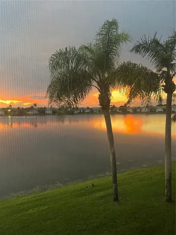 a kitchen with a microwave a stove and refrigerator