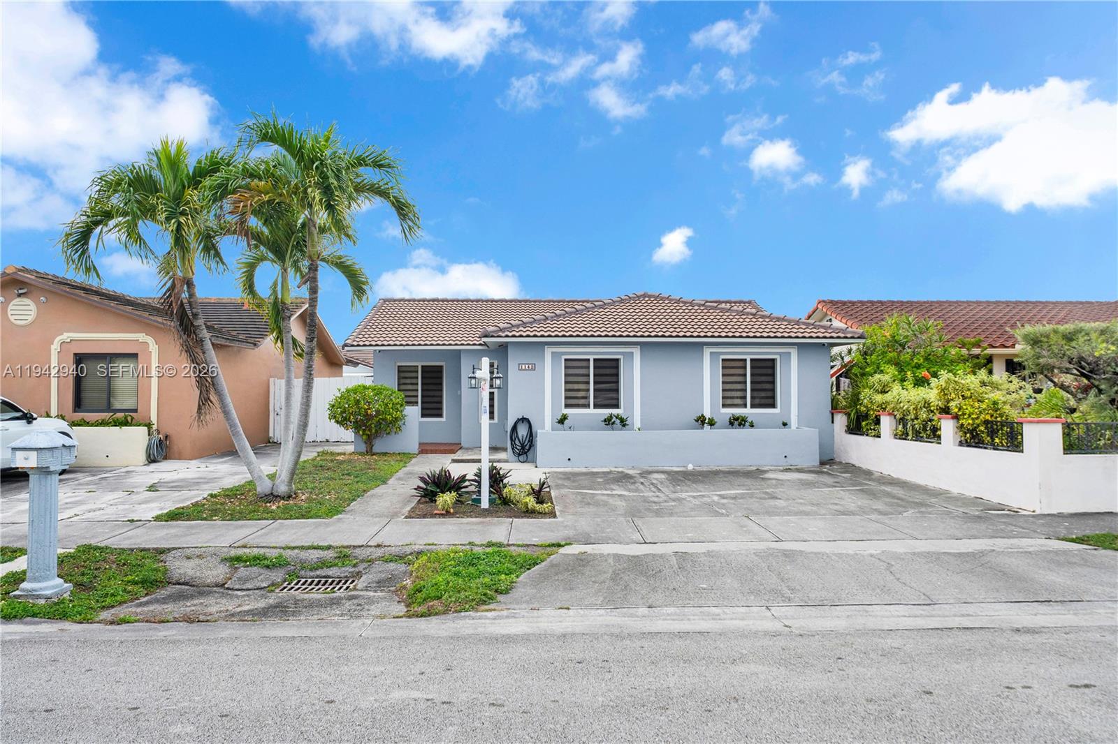 1142 Southwest 138th Court Miami, FL 33184 - Photo 1 of 50 a front view of a house with garden and porch