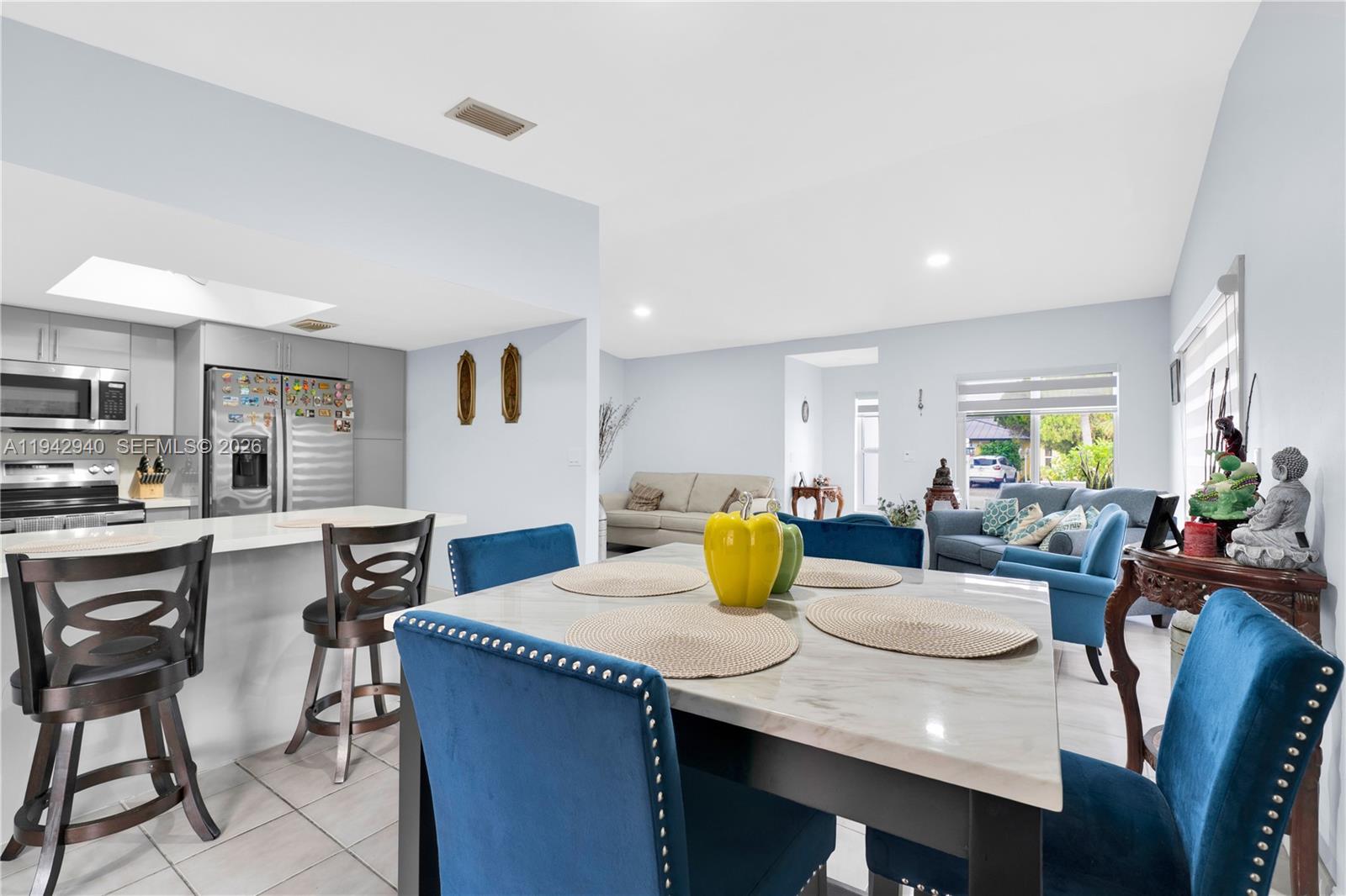 1142 Southwest 138th Court Miami, FL 33184 - Photo 12 of 50 a view of a dining room with furniture and wooden floor
