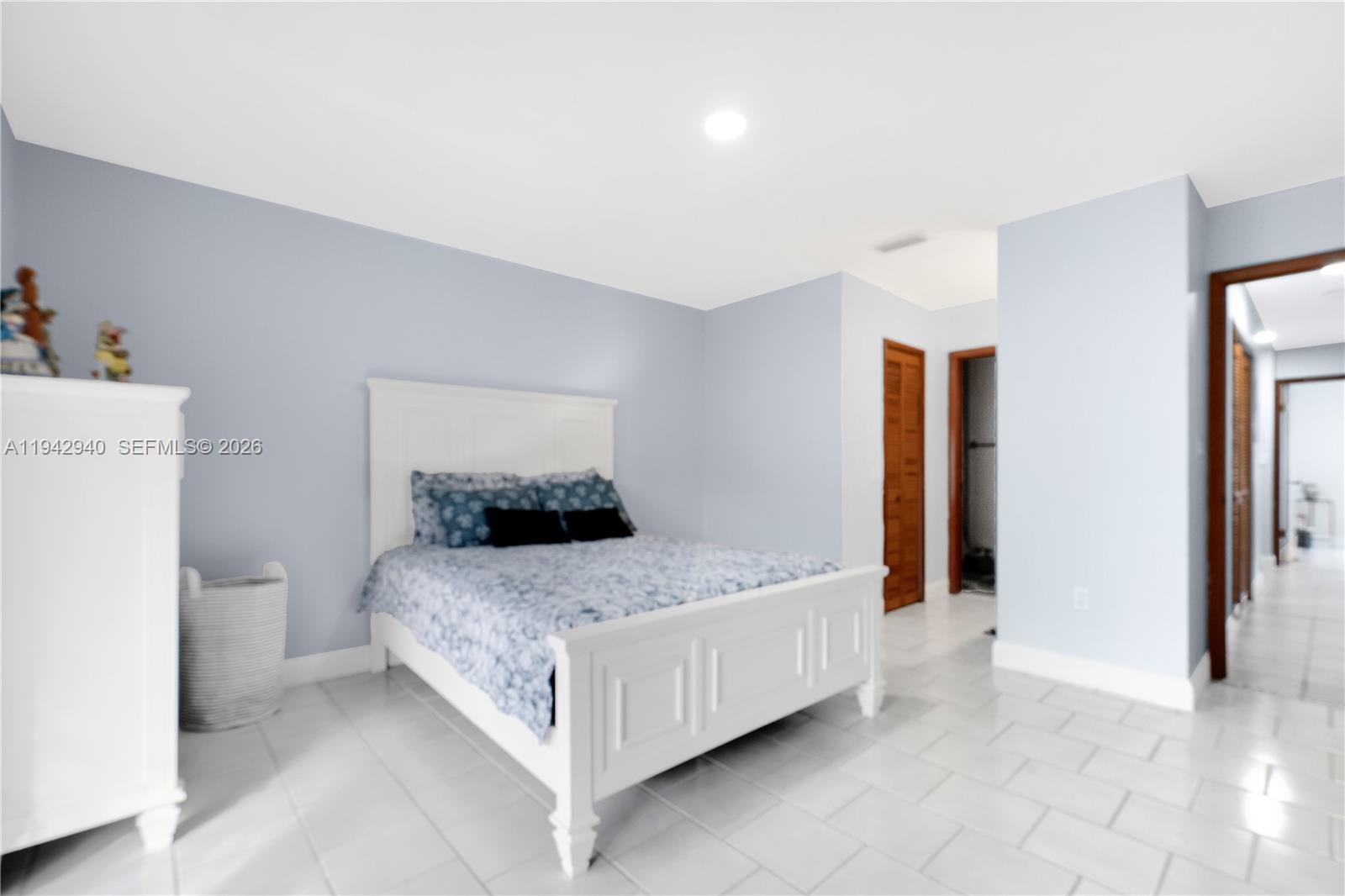 1142 Southwest 138th Court Miami, FL 33184 - Photo 18 of 50 a bedroom with a bed and a refrigerator