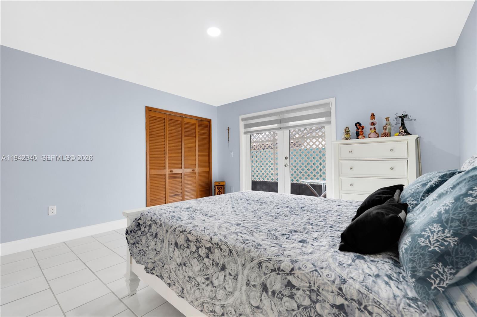 1142 Southwest 138th Court Miami, FL 33184 - Photo 21 of 50 a bedroom with a bed window and dresser