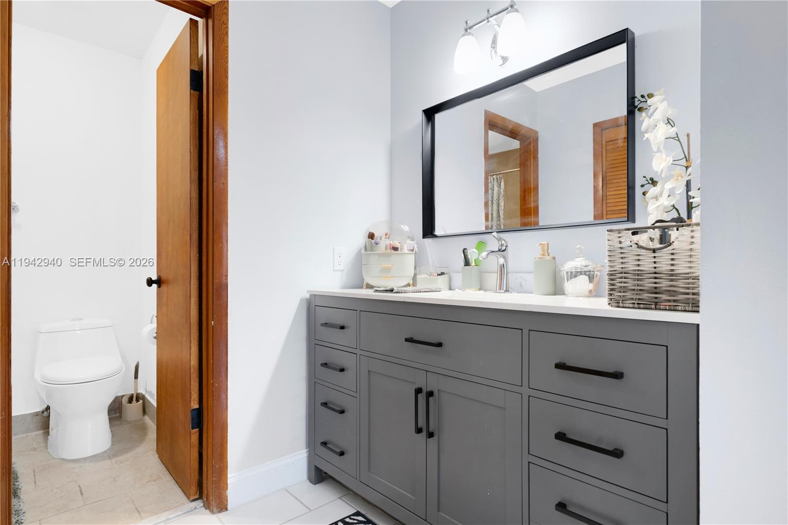 1142 Southwest 138th Court Miami, FL 33184 - Photo 24 of 50 a bathroom with a sink and a mirror