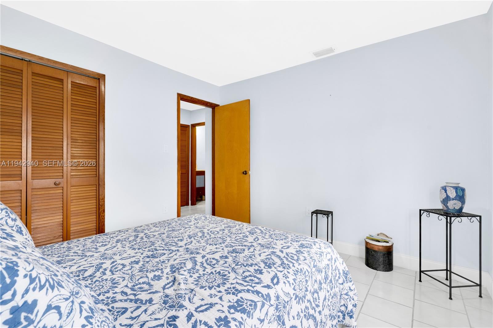 1142 Southwest 138th Court Miami, FL 33184 - Photo 27 of 50 a bedroom with a bed and a dresser