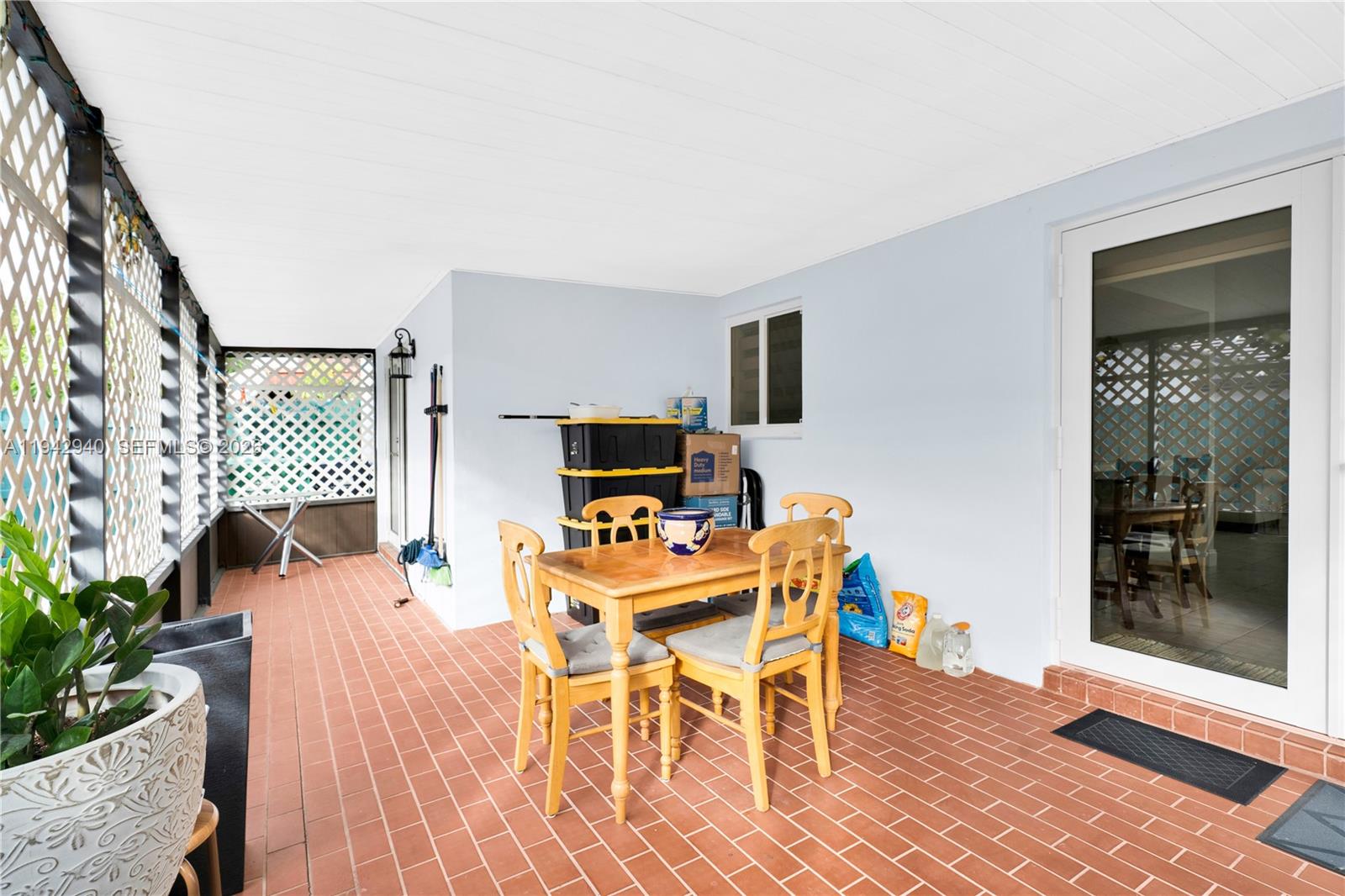 1142 Southwest 138th Court Miami, FL 33184 - Photo 33 of 50 a workspace with furniture wooden floor and a rug