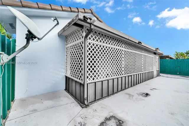an aerial view of residential houses with street