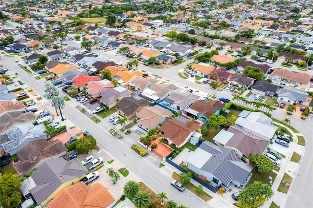 an aerial view of multiple house with yard