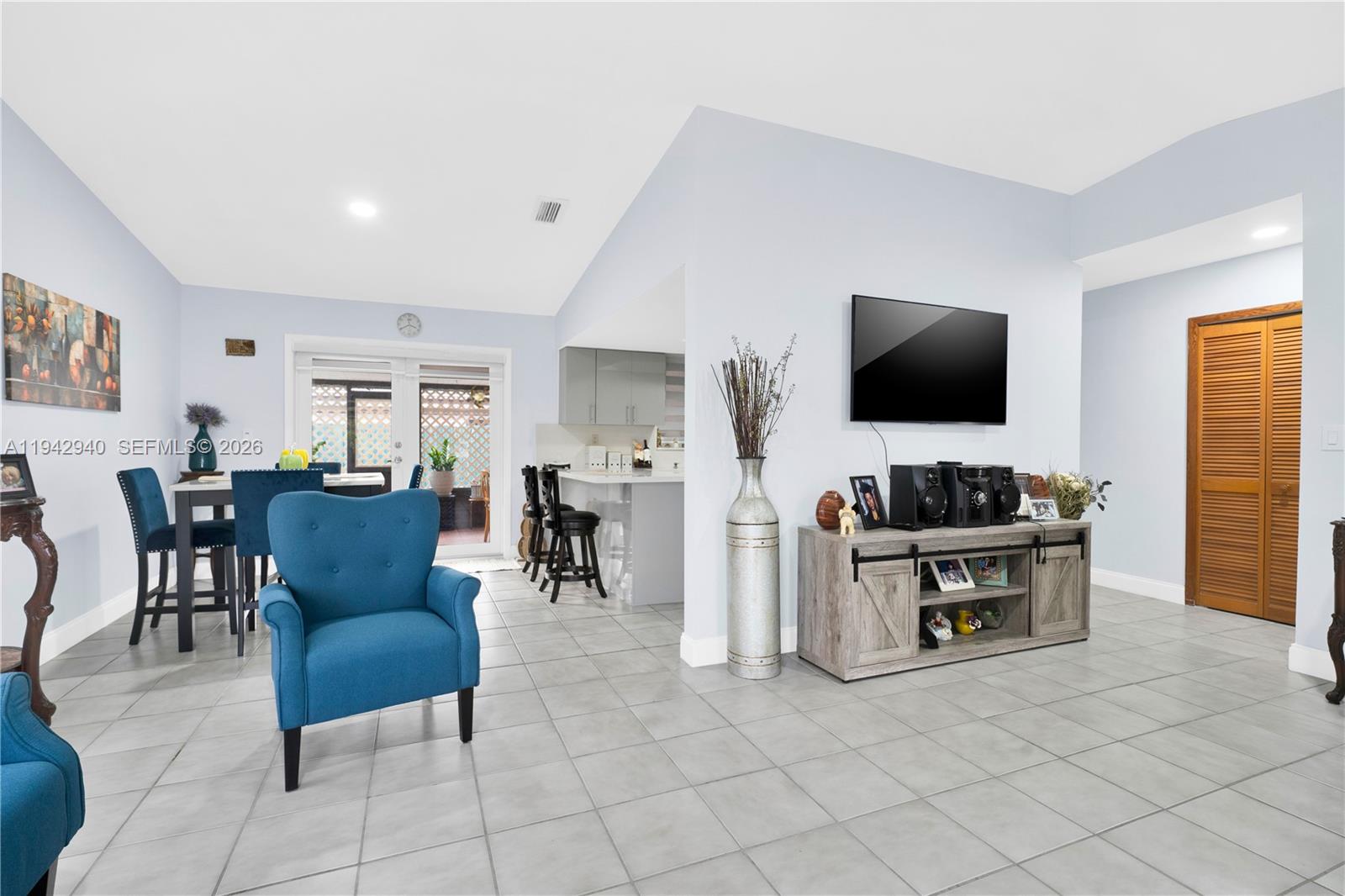 1142 Southwest 138th Court Miami, FL 33184 - Photo 10 of 50 a living room with furniture and a flat screen tv