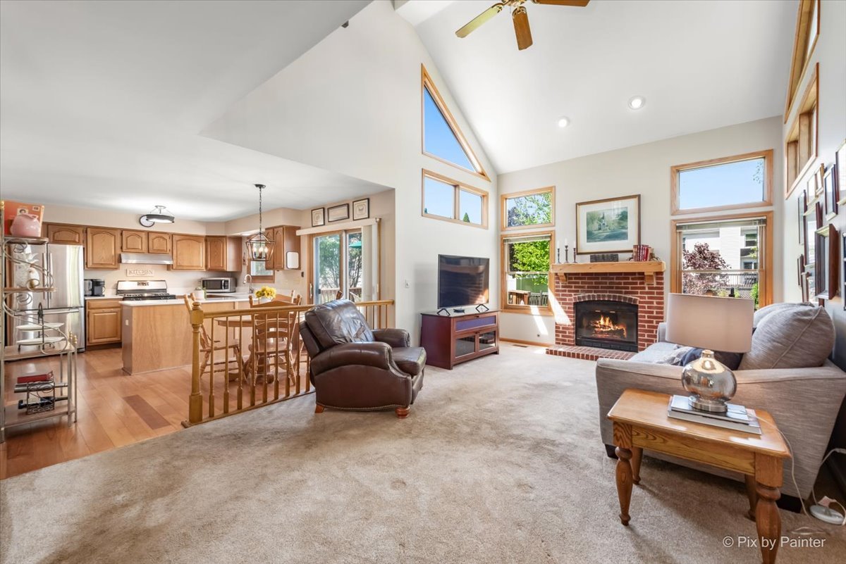 121 Hampton Street Cary, IL 60013 - Photo 21 of 56 a living room with furniture a fireplace and a large window