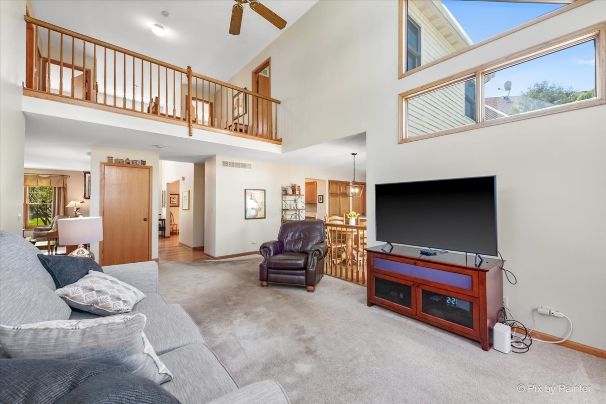 121 Hampton Street Cary, IL 60013 - Photo 22 of 56 a living room with furniture and a flat screen tv