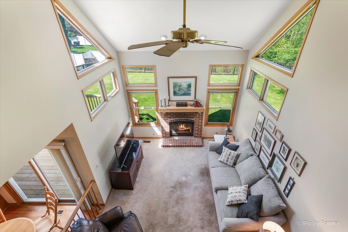 121 Hampton Street Cary, IL 60013 - Photo 23 of 56 a living room with furniture and a fireplace