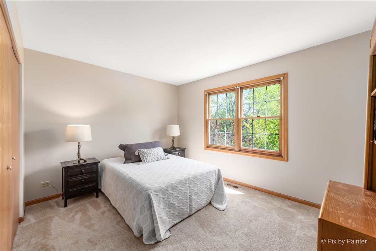 121 Hampton Street Cary, IL 60013 - Photo 31 of 56 a bedroom with a bed and window