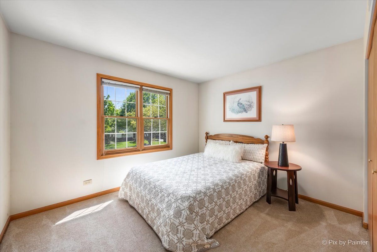 121 Hampton Street Cary, IL 60013 - Photo 32 of 56 a bedroom with a bed and a window