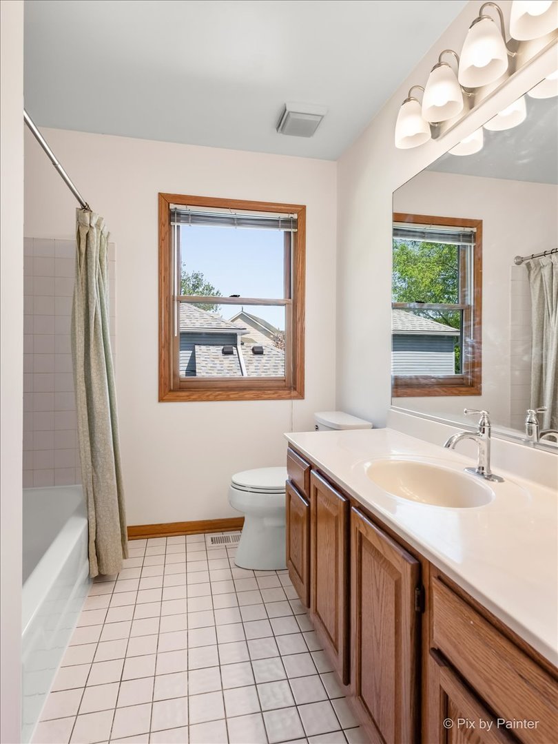 121 Hampton Street Cary, IL 60013 - Photo 34 of 56 a bathroom with a sink a toilet a mirror and shower