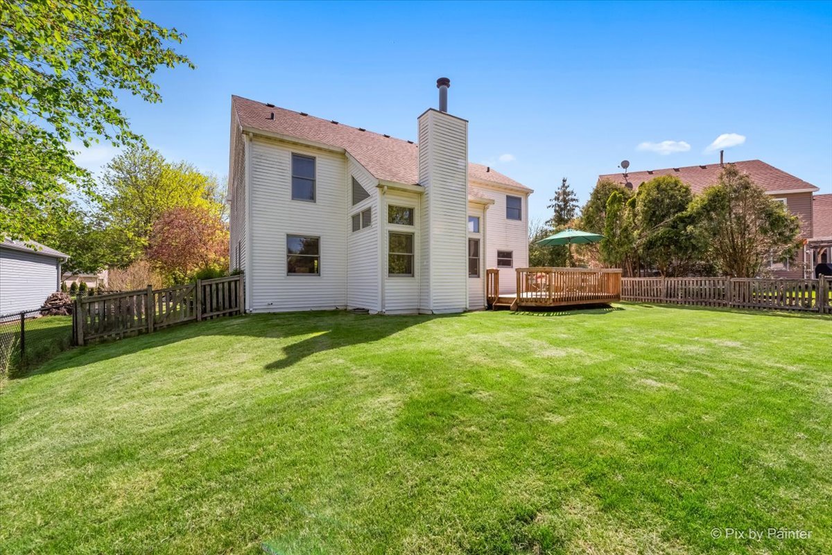 121 Hampton Street Cary, IL 60013 - Photo 38 of 56 a view of a house with a back yard