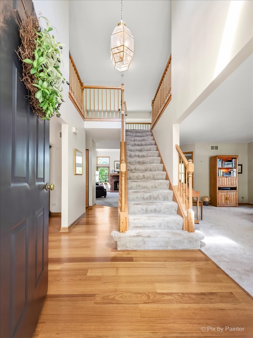 121 Hampton Street Cary, IL 60013 - Photo 4 of 56 a view of entryway and hall with wooden floor