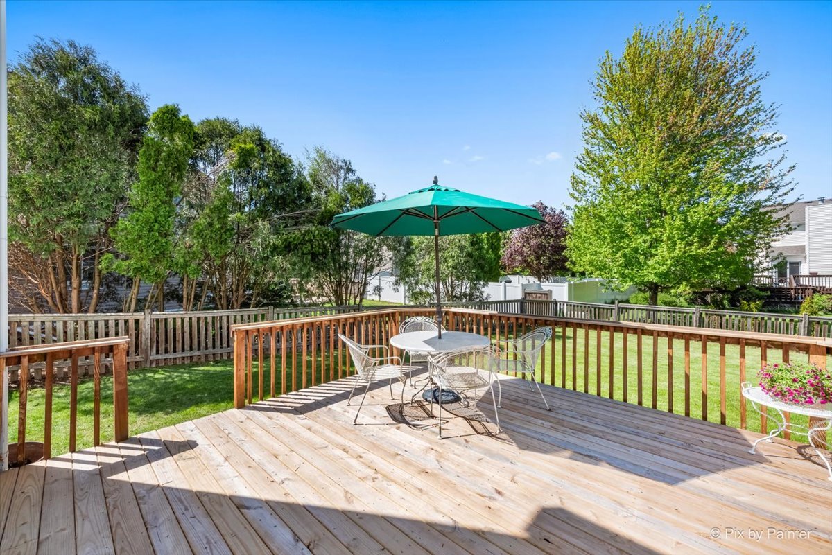 121 Hampton Street Cary, IL 60013 - Photo 42 of 56 a view of a deck with furniture and wooden floor
