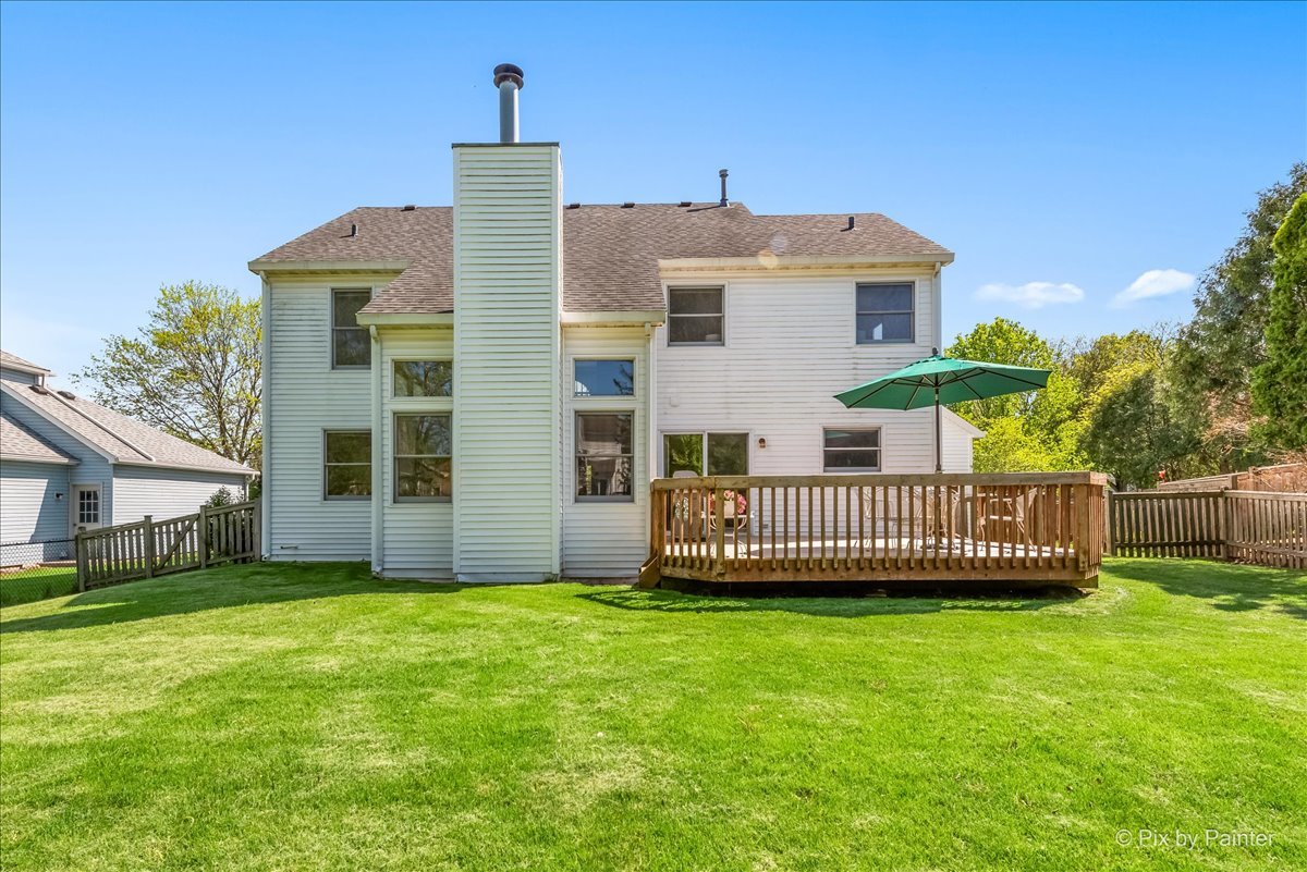121 Hampton Street Cary, IL 60013 - Photo 44 of 56 a view of a house with a yard and deck