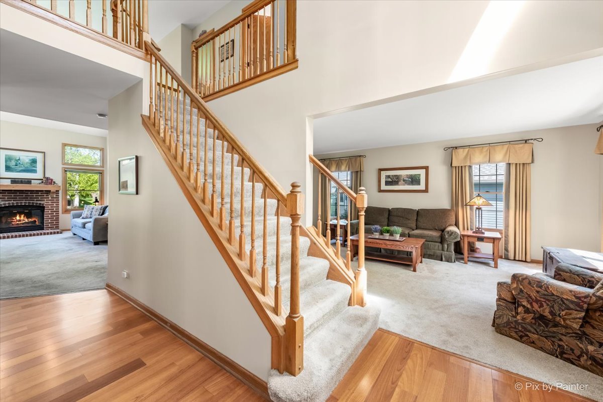 121 Hampton Street Cary, IL 60013 - Photo 8 of 56 a living room with furniture and a fireplace