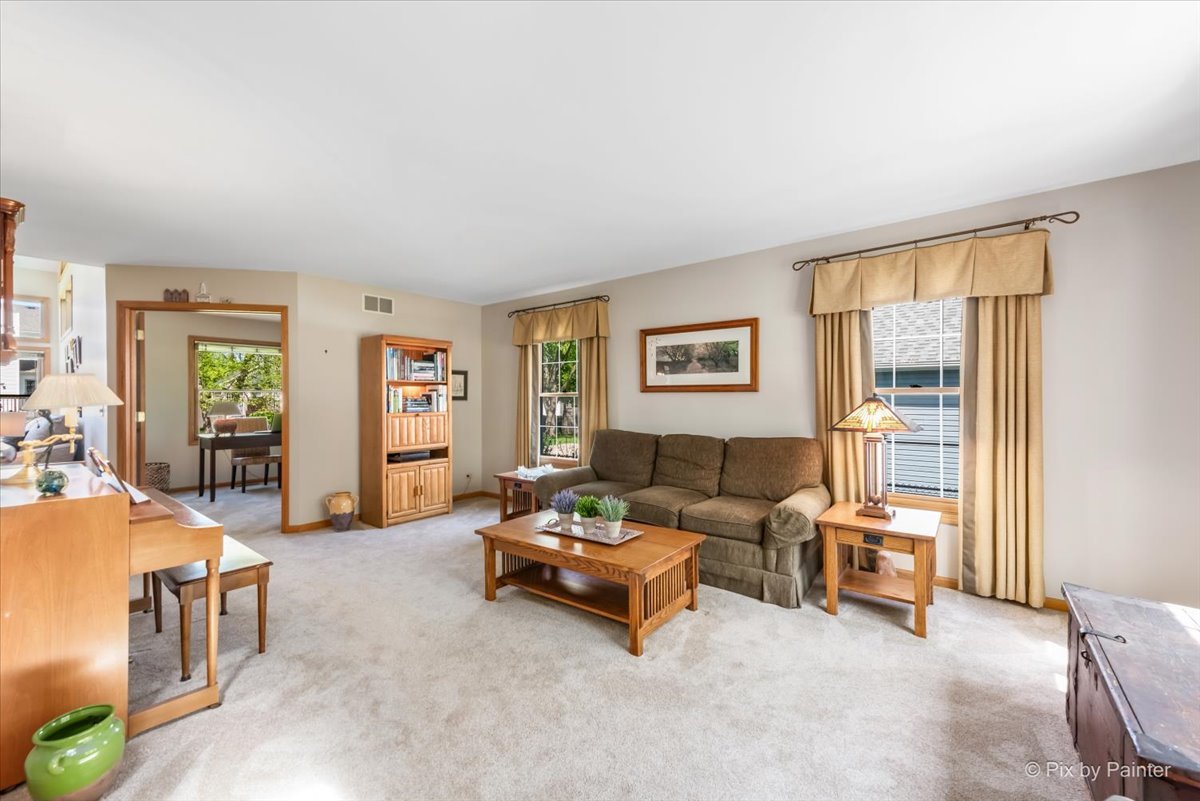 121 Hampton Street Cary, IL 60013 - Photo 10 of 56 a living room with furniture and a window