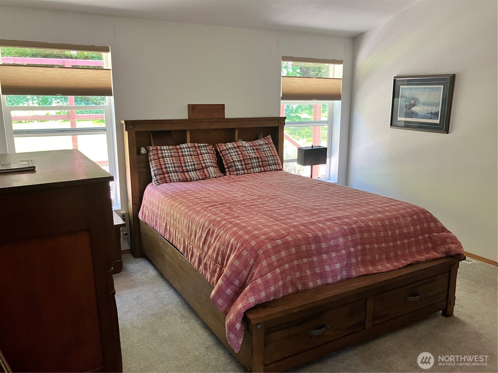 1171 Ray Hicks Street Raymond, WA 98577 - Photo 18 of 33 a large bed sitting in a bedroom next to a window