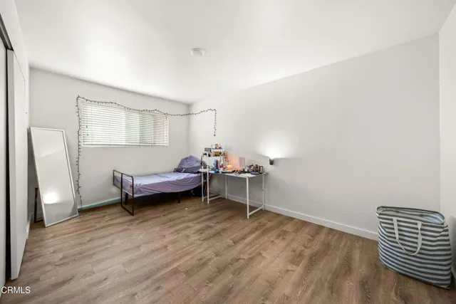 a bedroom with furniture and a window