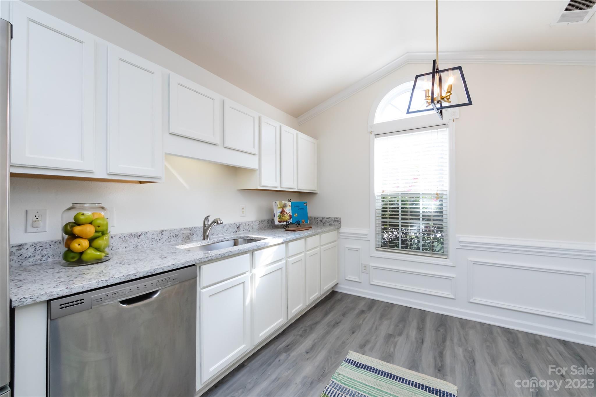 13009 Beddingfield Drive Charlotte, NC 28278 - Photo 11 of 32 a kitchen with a sink a window cabinets and appliances