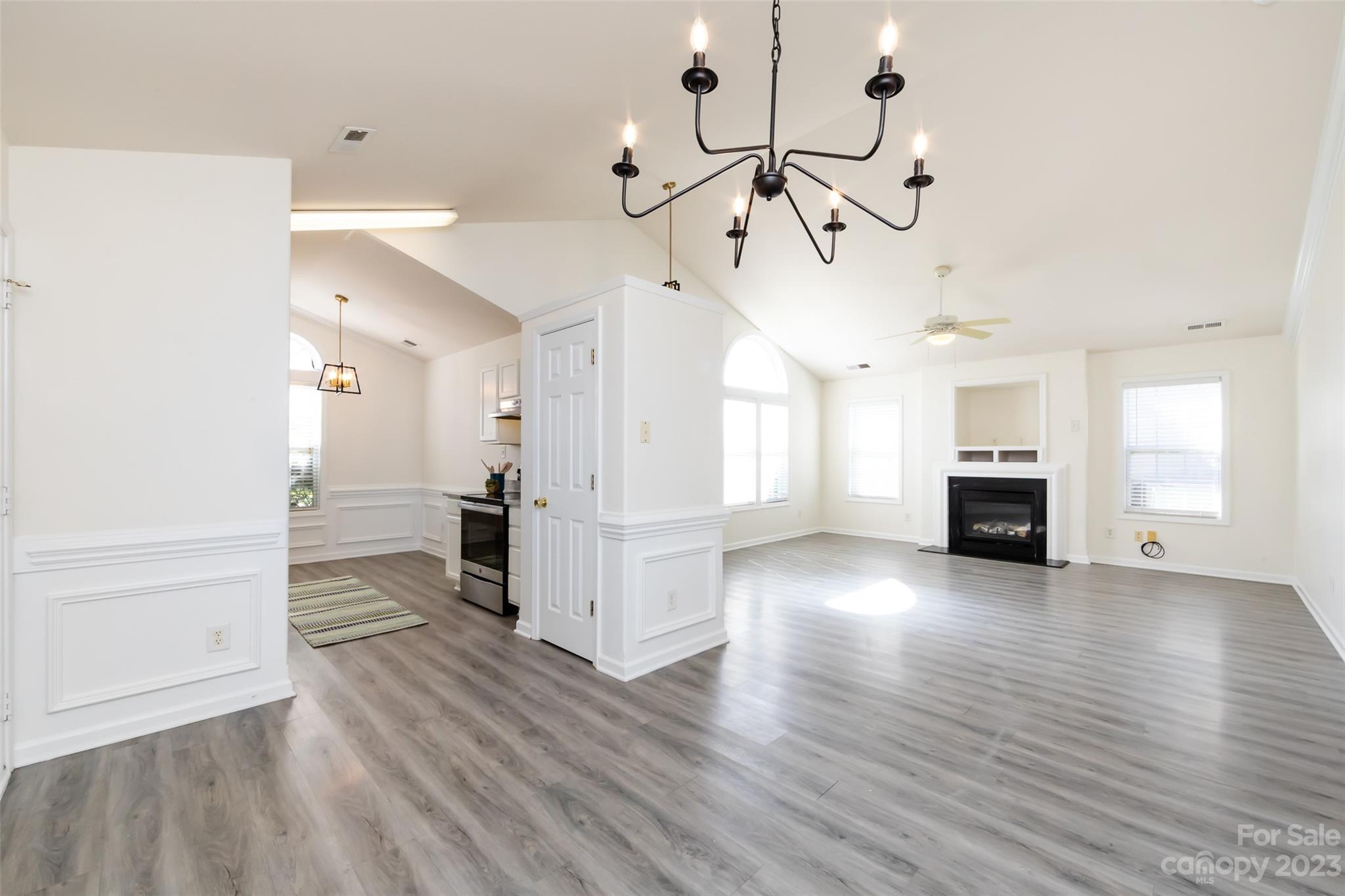 13009 Beddingfield Drive Charlotte, NC 28278 - Photo 9 of 32 a view interior of a house wooden floor and a chandelier