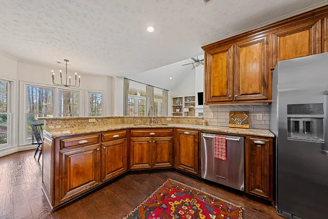 a bathroom with a tub sink and mirror