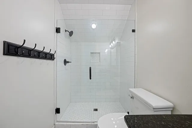 a sign that is sitting on a brick wall