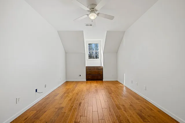 an aerial view of a house with a swimming pool