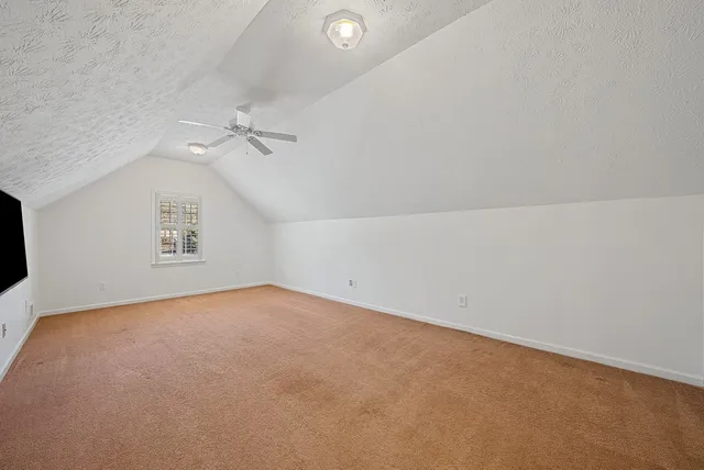 a view of a backyard with sitting area