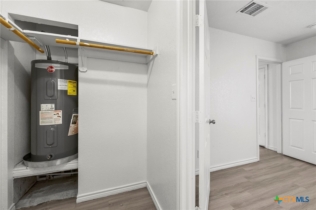 115 North 20th Street Temple, TX 76501 - Photo 8 of 8 a view of walk in closet with clothes and shoes