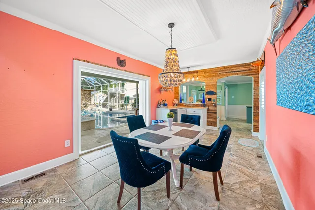 a dining room with furniture and wooden floor
