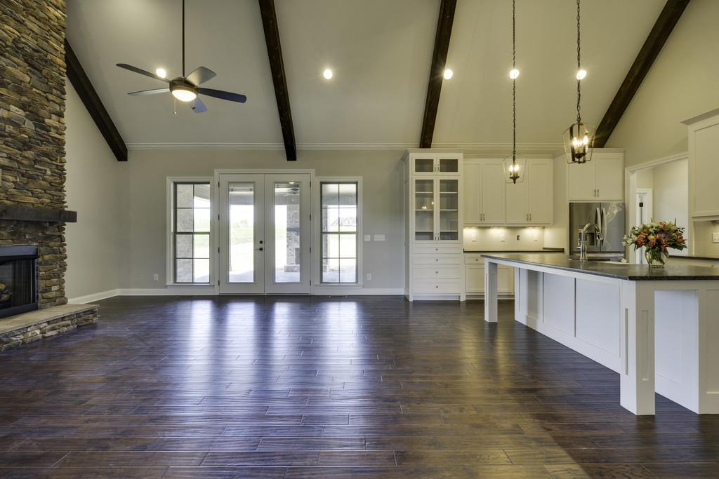 2140 Allisona Road Eagleville, TN 37060 - Photo 13 of 30 a view of an empty room and kitchen with wooden floor