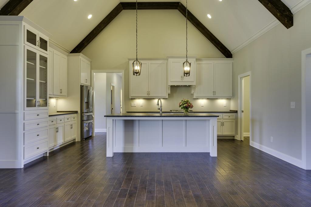 2140 Allisona Road Eagleville, TN 37060 - Photo 16 of 30 a kitchen with stainless steel appliances a sink cabinets and wooden floor