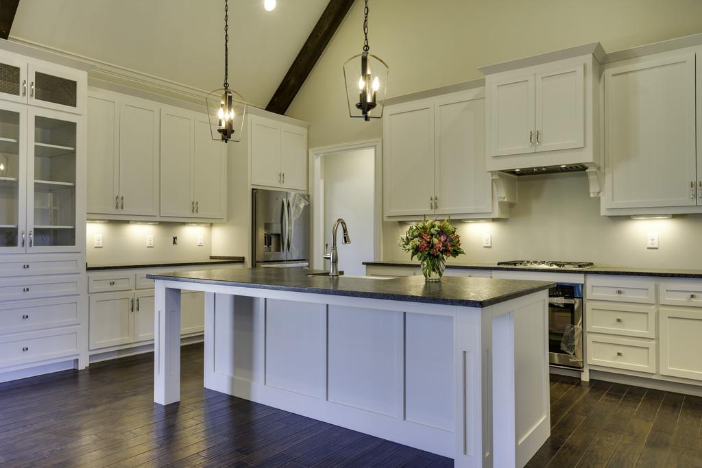 2140 Allisona Road Eagleville, TN 37060 - Photo 17 of 30 a kitchen with stainless steel appliances granite countertop a sink a stove and cabinets