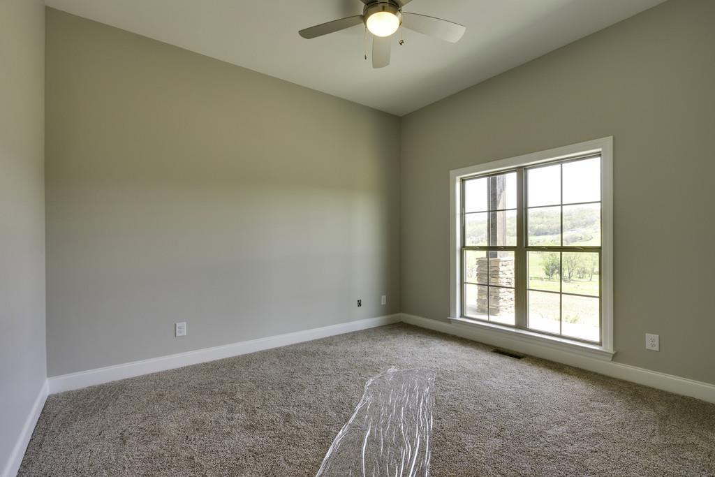 2140 Allisona Road Eagleville, TN 37060 - Photo 23 of 30 an empty room with chandelier fan