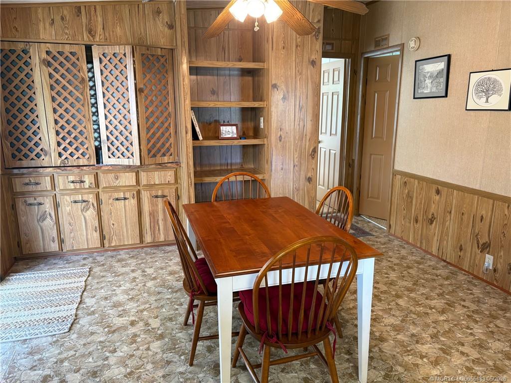 2856 Southwest Toronado Trail Stuart, FL 34997 - Photo 11 of 20 a view of a dining room with furniture