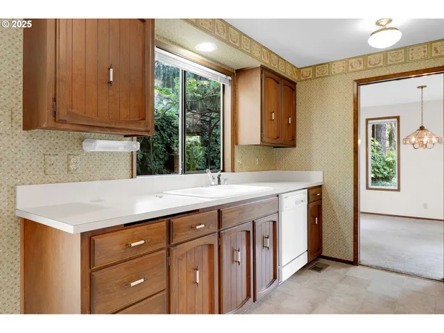 a view of a room with a large window