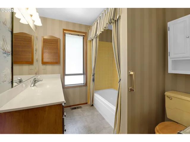a bathroom with a sink a vanity and a mirror