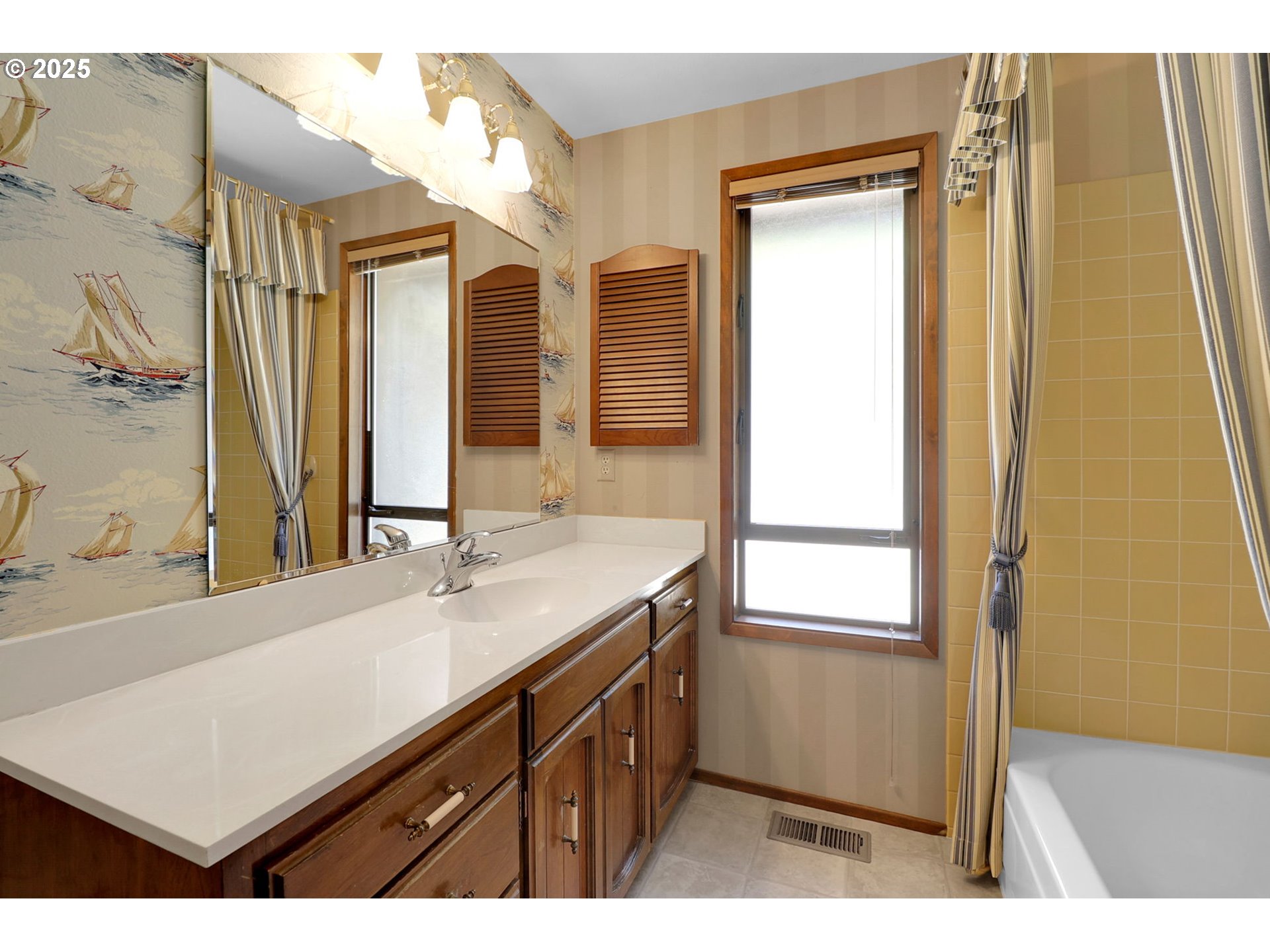 1254 Rio Glen Drive Eugene, OR 97401 - Photo 26 of 43 a bathroom with a sink a vanity and a mirror