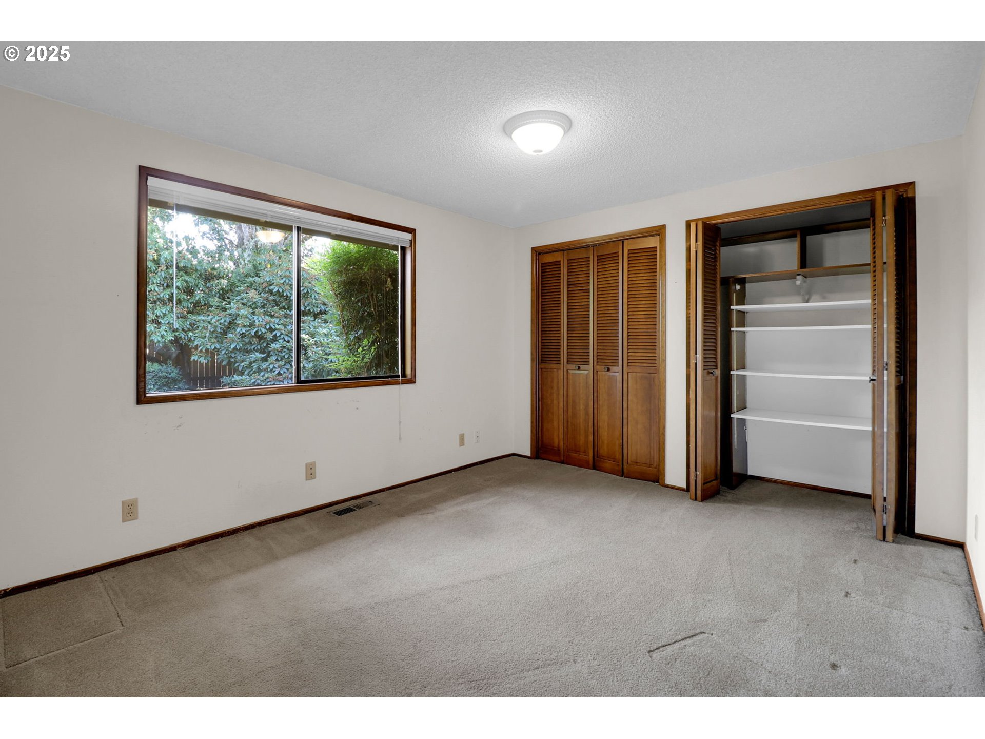 1254 Rio Glen Drive Eugene, OR 97401 - Photo 31 of 43 a view of an empty room with a window
