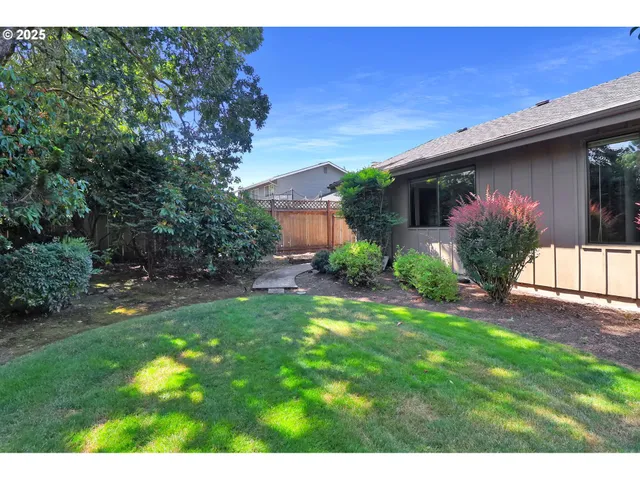 a view of backyard with green space