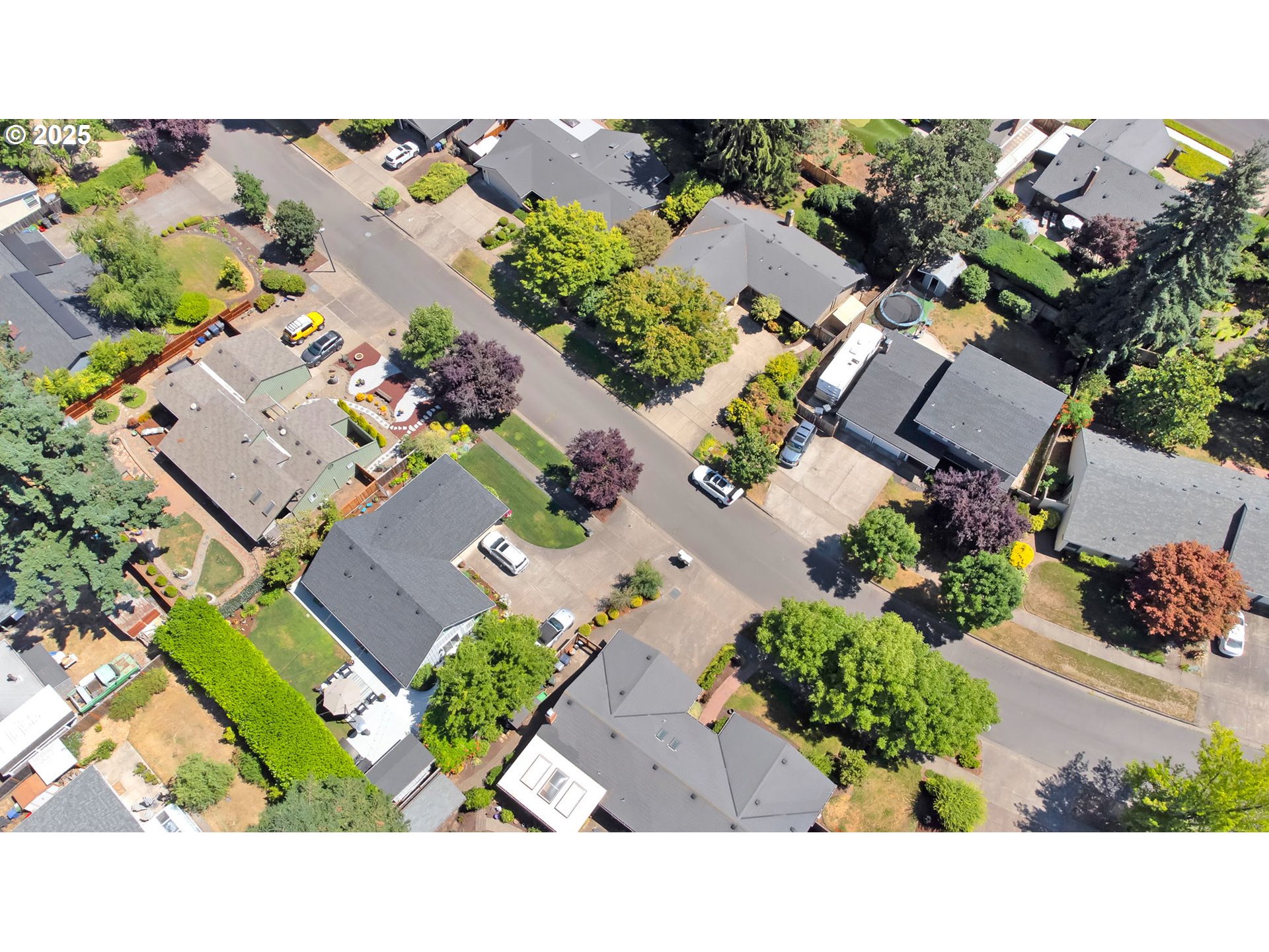 1254 Rio Glen Drive Eugene, OR 97401 - Photo 41 of 43 an aerial view of a house with a yard and tennis court