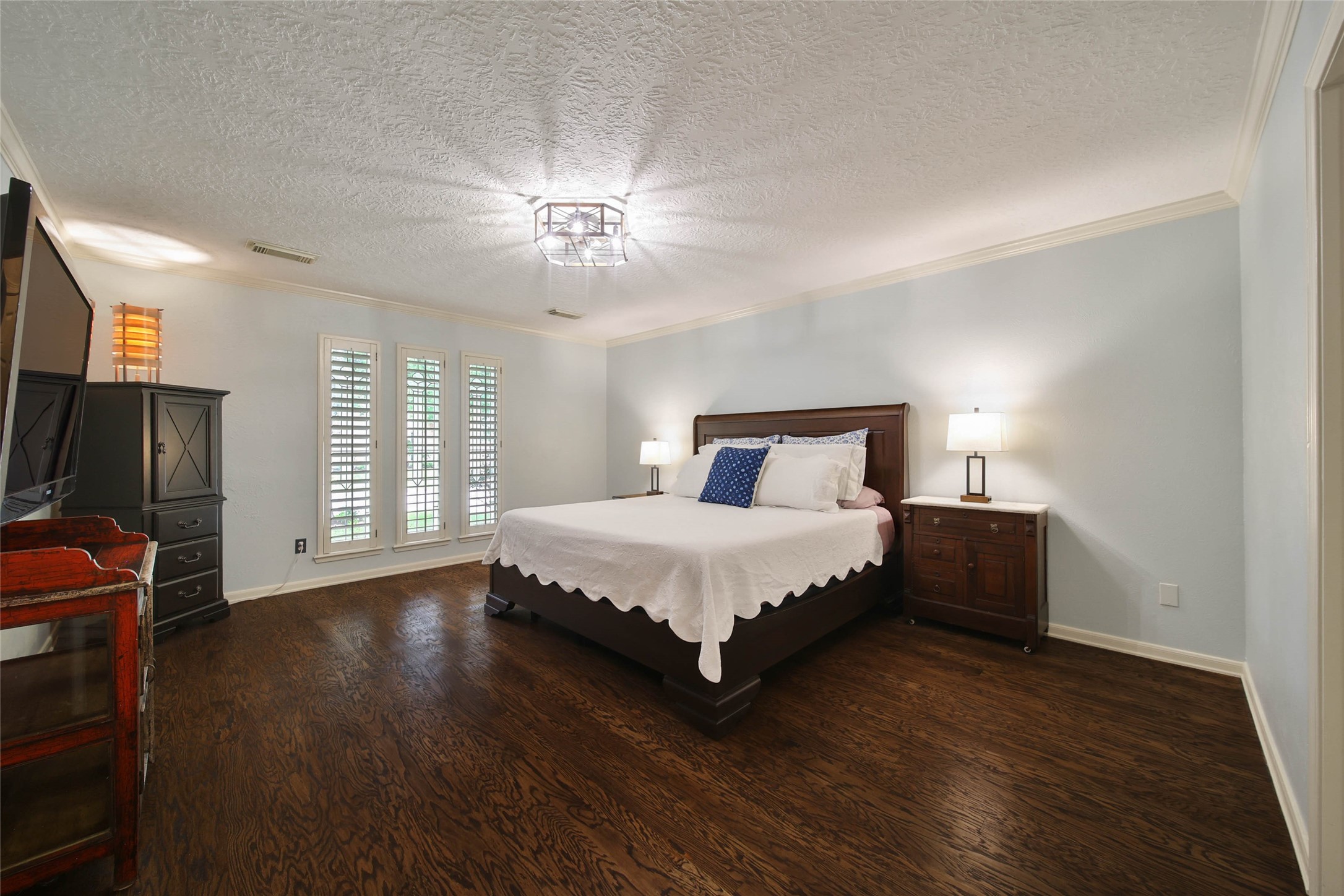 17007 Windrow Drive Spring, TX 77379 - Photo 20 of 46 a bedroom with a bed and wooden floor