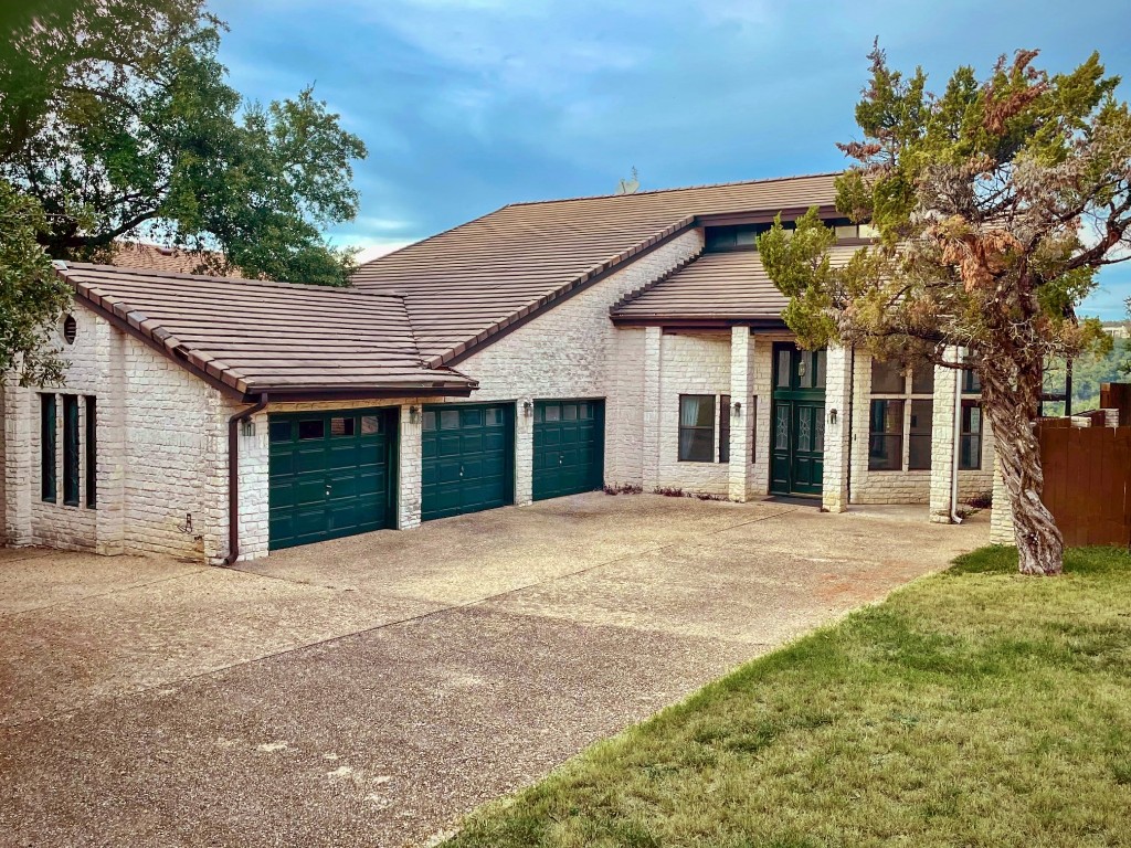 4324 Far W Boulevard Austin, TX 78731 - Photo 13 of 29 a view of a house with a yard and potted plants